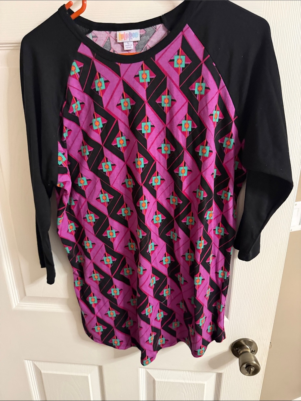 LuLaRoe Girls Black Raglan Top with Purple Geometric Print